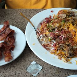 Village Diner - Side of bacon  Stuffed hash browns and gluten free toast.
