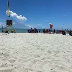 Aloha Watersports - Sitting under an umbrella, while another member of our party stands in line.