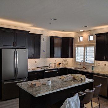 Revamp Kitchen & Bath - a kitchen with black cabinets - Kitchen & Bath Near Me - Glendale, Arizona Revamp Kitchen & Bath - a kitchen with black cabinets - Kitchen & Bath Near Me - Glendale, Arizona