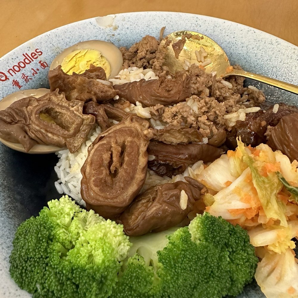Q Noodles - Pork intestines over rice with pickled cabbage and. Broccoli - Noodles Near Me - Cary, North Carolina Q Noodles - Pork intestines over rice with pickled cabbage and. Broccoli - Noodles Near Me - Cary, North Carolina
