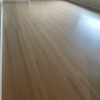 Tap Quality Flooring - a hardwood floor in a living room - Flooring Near Me Tap Quality Flooring - a hardwood floor in a living room - Flooring Near Me