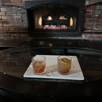The 1901 - Drinks by the fire old fashion and buffalo soul-ger drink. - Italian Near Me - Oxnard, California The 1901 - Drinks by the fire old fashion and buffalo soul-ger drink. - Italian Near Me - Oxnard, California