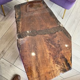 Beatiful raw edged wood tables and counters.
