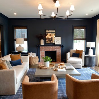 Skyline Window Coverings - West - Natural woven shades on one wall, custom drapes on the other; the pairings and design choices are endless! - Shutters Near Me