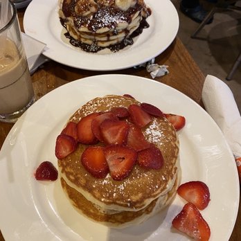 Elly's Brunch & Cafe - Pancakes with strawberries on top and banana Nutella pancakes. - Breakfast & Brunch Near Me - Phoenix, Arizona