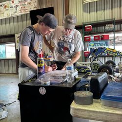 North Texas Karters - Bob teaching Maverick how to work on his kart.