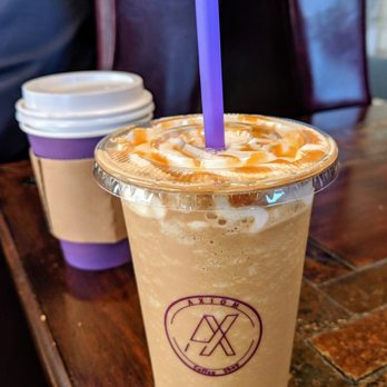 Axiom Coffee - Small Ethiopian Coffee in the background and a Regular Caramel Frappuccino in the foreground. - Coffee & Tea Near Me - Fort Worth, Texas