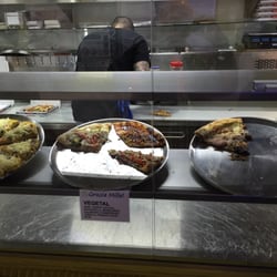 Grazie Mille - Their website makes it look like fine dining, but it's basically just a place to get a slice.