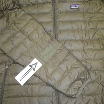 Rainy Pass Repair - A small patch on the arm of a down coat to cover a burn hole. - Sewing & Alterations Near Me - Seattle, Washington