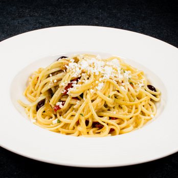 Casa Americo - a plate of pasta with olives and parmesan cheese - Italian Near Me - Milton, Ontario