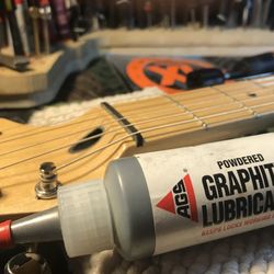 White Glove Guitar Service - Graphite lube the nut slots to eliminate string popping
