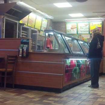 Subway - a woman standing at a counter in a restaurant - Sandwiches Near Me - Flat Rock, Michigan Subway - a woman standing at a counter in a restaurant - Sandwiches Near Me - Flat Rock, Michigan