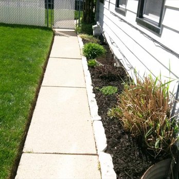 Martin's Landscaping - a side yard with a flower bed - Landscaping Near Me Martin's Landscaping - a side yard with a flower bed - Landscaping Near Me