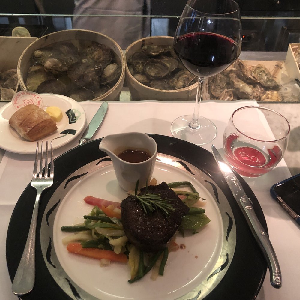 Malbec, steak dinner with pepper sauce and veggies, a side of bread.