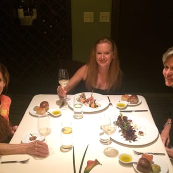 Kai - Friends eating in the wine room - New American Near Me - Phoenix, Arizona