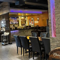 Fuji Japanese Steak House - Sushi case & bar where they don't serve you. Not sure why they have chairs there. I guess it's for decoration??