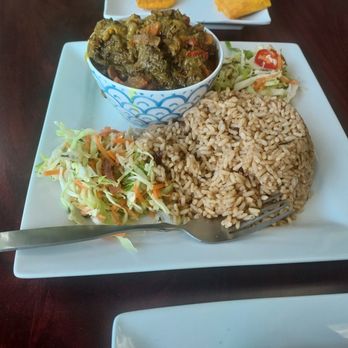 Nadia’s Jamaican Kitchen - Curry goat entre. Served with rice and Peas and slaw. - Caribbean Near Me - Brooklyn Park, Minnesota