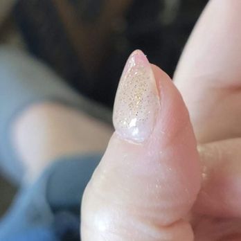 A Nails & Beauty Supply - This shows the right corner of my thumbnail bed with an uneven bump and no gold glitter nailpolish. - Nail Salons Near Me - Astoria, Oregon A Nails & Beauty Supply - This shows the right corner of my thumbnail bed with an uneven bump and no gold glitter nailpolish. - Nail Salons Near Me - Astoria, Oregon