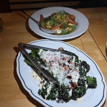 Vern's - broccolini in foreground - woodfired with chilies, a caesar dressing under and parm on top- super yum - New American Near Me - Rochester, New York Vern's - broccolini in foreground - woodfired with chilies, a caesar dressing under and parm on top- super yum - New American Near Me - Rochester, New York