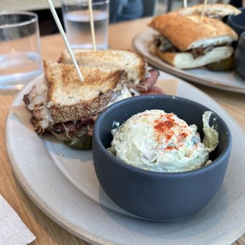 Gold Finch - Corn beef/Pastrami Sandwich with potato salad side - Delis Near Me - San Diego, California Gold Finch - Corn beef/Pastrami Sandwich with potato salad side - Delis Near Me - San Diego, California