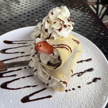Rachel's Cafe & Creperie - Cheesecake strawberries graham cracker crumbs whipped cream Nutella and chocolate drizzle - Creperies Near Me - Lancaster, Pennsylvania