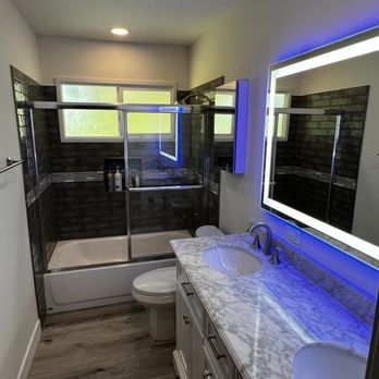 Nailed It Construction - a bathroom with a large mirror - General Contractors Near Me Nailed It Construction - a bathroom with a large mirror - General Contractors Near Me