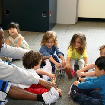 Temple Sholom Selma Maisel Nursery School - Stretching in Gym with Jerry. - Child Care & Day Care Near Me - Greenwich, Connecticut Temple Sholom Selma Maisel Nursery School - Stretching in Gym with Jerry. - Child Care & Day Care Near Me - Greenwich, Connecticut