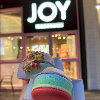 JOY Macarons - a hand holding a colorful macaron - Macarons Near Me - Fort Worth, Texas JOY Macarons - a hand holding a colorful macaron - Macarons Near Me - Fort Worth, Texas
