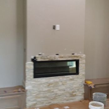 Gallardo's Construction and painting - Adding faux stone to decorate this fire place. - General Contractors Near Me Gallardo's Construction and painting - Adding faux stone to decorate this fire place. - General Contractors Near Me