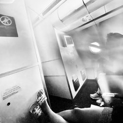 Hawaiian Airlines - Social distancing when flying; 7 inches at best if they are zonked out sleeping