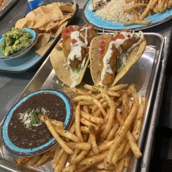 Simply Fish Seafood - Battered fish tacos/chips and guacamole/halibut w/ garlic butter - Fish & Chips Near Me - Costa Mesa, California Simply Fish Seafood - Battered fish tacos/chips and guacamole/halibut w/ garlic butter - Fish & Chips Near Me - Costa Mesa, California