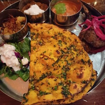 Pondicheri - Texan Thali (potatoes, salad, ground lamb, lamb chop, butter chicken, & garlic naan) for $28. - Indian Near Me - Houston, Texas Pondicheri - Texan Thali (potatoes, salad, ground lamb, lamb chop, butter chicken, & garlic naan) for $28. - Indian Near Me - Houston, Texas