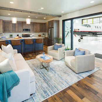 Tyler Electric - Custom lighting installation completed for this hangar living space, creating a warm, comfortable environment connected to the aircraft bay. - Electricians Near Me - Bozeman, Montana Tyler Electric - Custom lighting installation completed for this hangar living space, creating a warm, comfortable environment connected to the aircraft bay. - Electricians Near Me - Bozeman, Montana