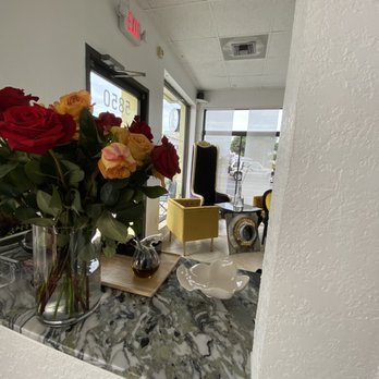 Amuse 5 Bakery - Fresh flowers between front door and seating in the room to the right. You can also see seating to the left of the front door. - Bakeries Near Me - Bradenton, Florida Amuse 5 Bakery - Fresh flowers between front door and seating in the room to the right. You can also see seating to the left of the front door. - Bakeries Near Me - Bradenton, Florida