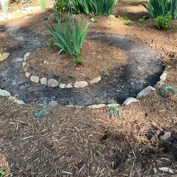 Leisure Landscapes - a smiley face made out of rocks - Landscaping Near Me - Durham, North Carolina