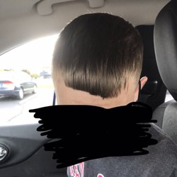 Off the Top Barber Shop & Salon - My son went and got his haircut. This is the result the "barber" let him walk out of the shop with! Looks like 2 year olds work!