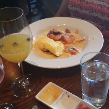 Murphy's - Shrimp n' grits with a blueberry mimosa. - American Near Me - Atlanta, Georgia Murphy's - Shrimp n' grits with a blueberry mimosa. - American Near Me - Atlanta, Georgia