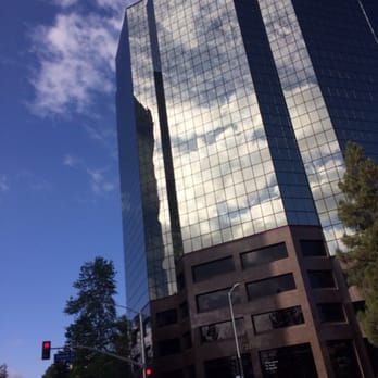 Warner Center Tower #6 - Beautiful building with the sky and clouds reflecting - Local Services Near Me - Woodland Hills, California Warner Center Tower #6 - Beautiful building with the sky and clouds reflecting - Local Services Near Me - Woodland Hills, California