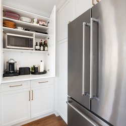 Final Draft Cabinetry - Keep counters clutter-free with a custom appliance garage. Love how this white cabinet hides the coffee station and microwave seamlessly.