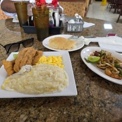 Jackson Soul Food - Fried catfish breakfast w/grits & cheese eggs. And a side order of grilled shrimp. Food was delicious. They will DEFINITELY see me again!