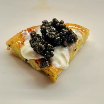 Uchiko Houston - Caviar on a waffle with sweet hot honey and crème fraiche - Sushi Bars Near Me - Houston, Texas Uchiko Houston - Caviar on a waffle with sweet hot honey and crème fraiche - Sushi Bars Near Me - Houston, Texas
