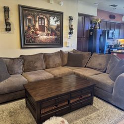 Eclectica Home - #1 Pic Brown cloth fabric sectional. 6 seat cushions, 7 back cushions. 3 dark brown throw pillows Good (condition B+ grade) sgs 4-9-24
