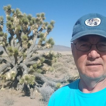 Out West Coffee - a man in a blue shirt and hat in the desert - Coffee Roasteries Near Me - Wellington, Nevada Out West Coffee - a man in a blue shirt and hat in the desert - Coffee Roasteries Near Me - Wellington, Nevada