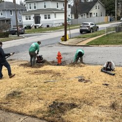D&J Lawn Care & Tree Services - Removing large roots from the bushes.