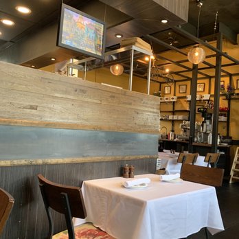 Bon Ami - a dining area with tables and chairs - Creperies Near Me - Denver, Colorado