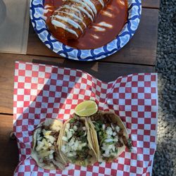 Wet asada burrito, quesabirria tacos and tacos.