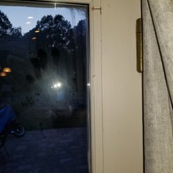 Queens Screen - Huge staple in the upper right hand corner as well as smeared caulk and his handprint all over the glass. -That I was supposed to clean up.