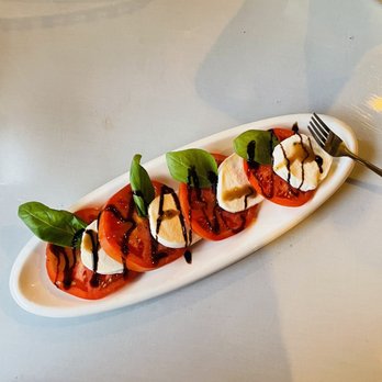 Valley Forge Trattoria & Lounge - a plate of tomatoes and mozzarella - Mediterranean Near Me - Phoenixville, Pennsylvania