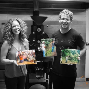 Yellow Brick Coffee - Love them! Anna and David holding photos of their coffee plantations they have visited and purchase from. - Coffee Roasteries Near Me - Tucson, Arizona Yellow Brick Coffee - Love them! Anna and David holding photos of their coffee plantations they have visited and purchase from. - Coffee Roasteries Near Me - Tucson, Arizona