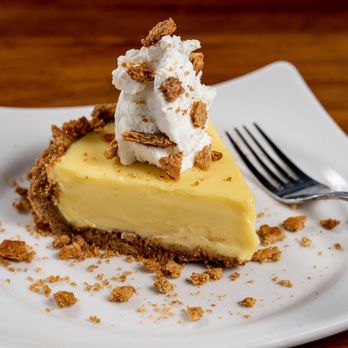 J. Alexander's - a slice of cheesecake on a plate - New American Near Me - Madison, Alabama J. Alexander's - a slice of cheesecake on a plate - New American Near Me - Madison, Alabama